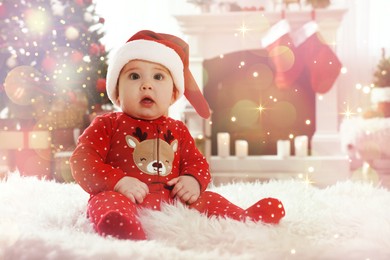 Baby in Santa hat and bright Christmas pajamas on floor at home. Magical festive atmosphere