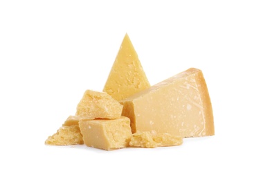 Photo of Pieces of delicious parmesan cheese on white background