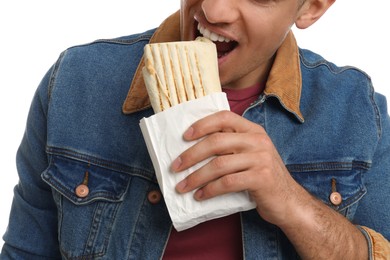 Photo of Man eating delicious shawarma on white background, closeup