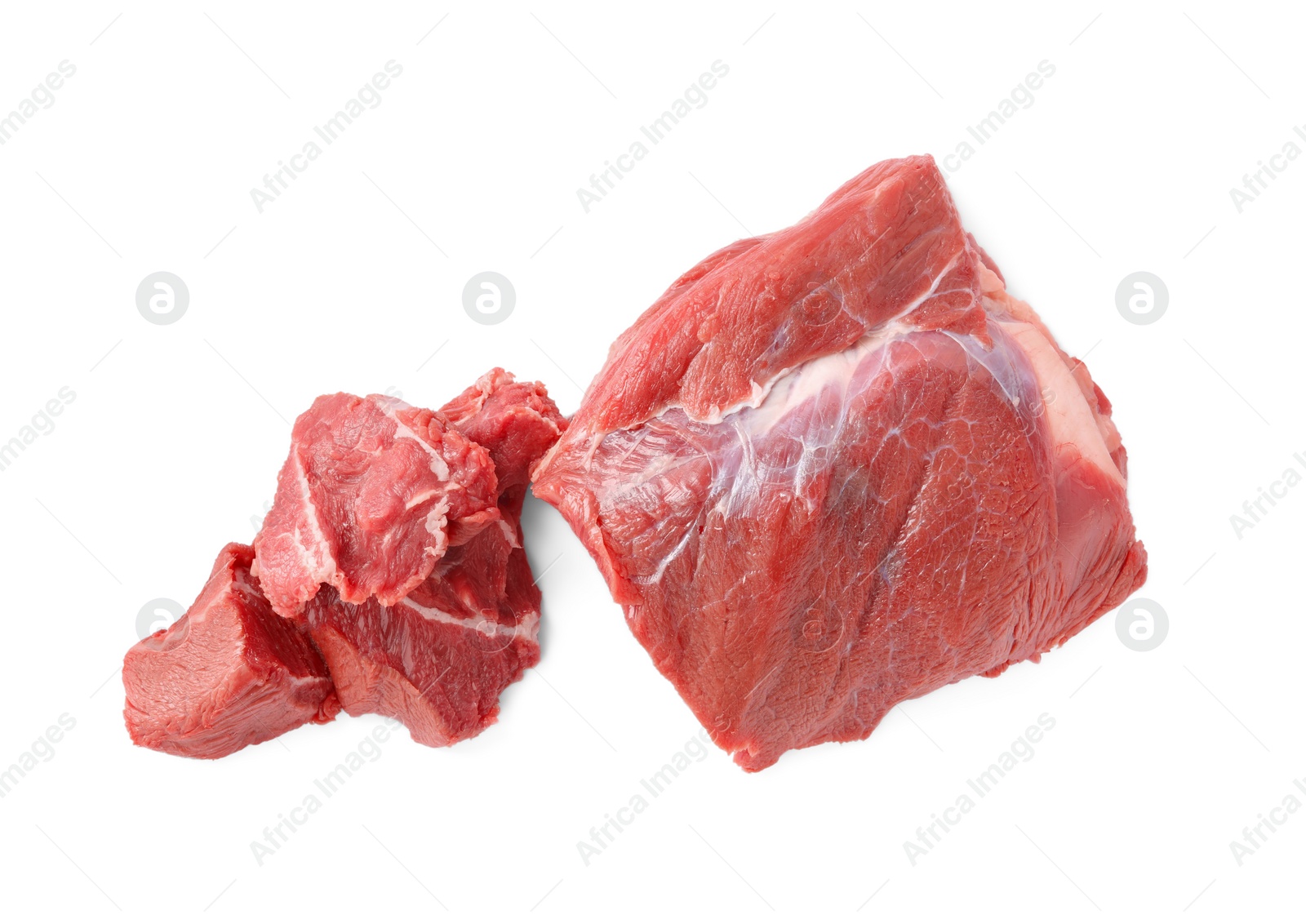 Photo of Pieces of raw beef meat isolated on white, top view