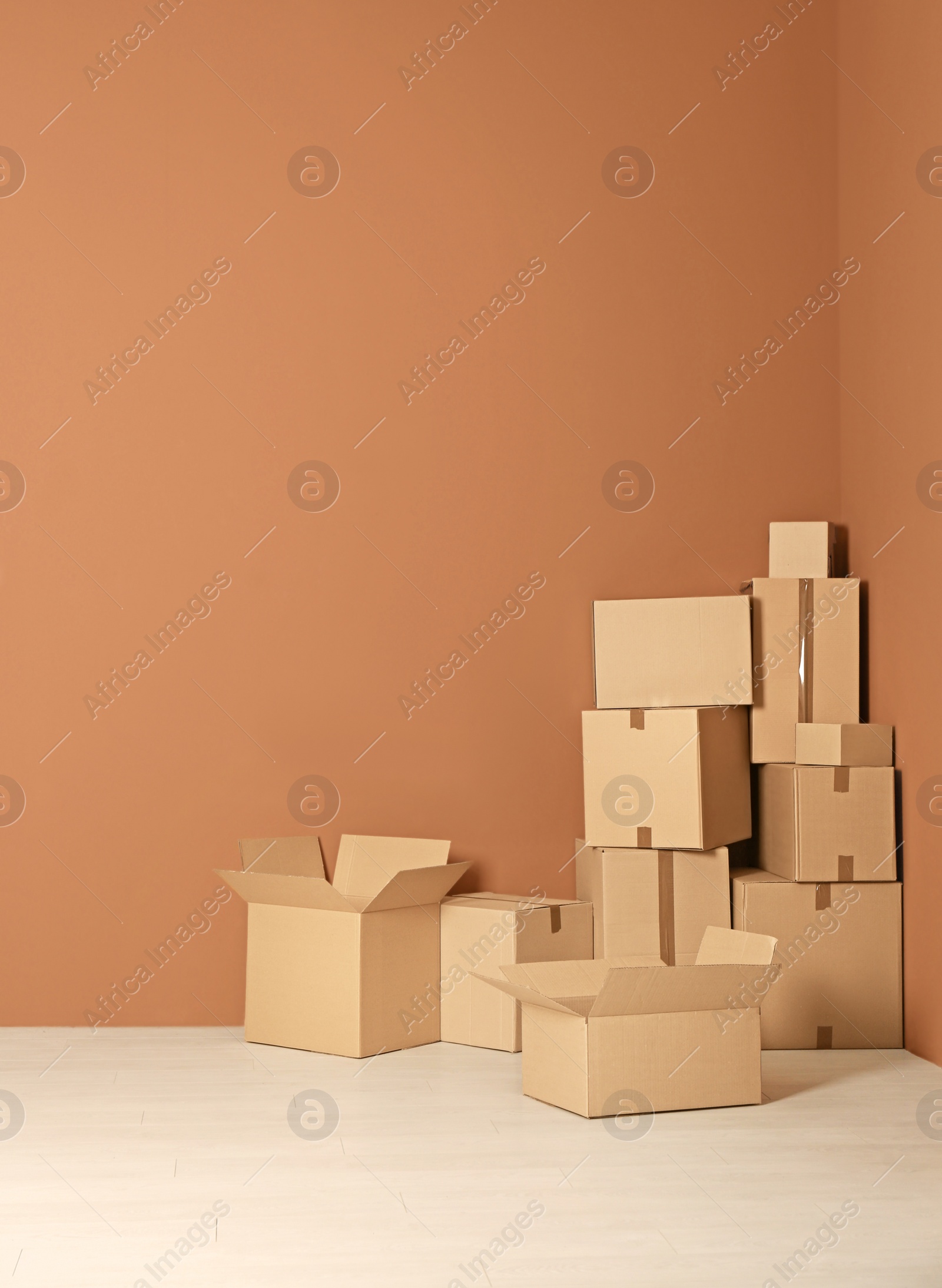 Photo of Cardboard boxes on floor indoors