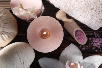 Photo of Composition with spa supplies and flowers on wooden table, flat lay