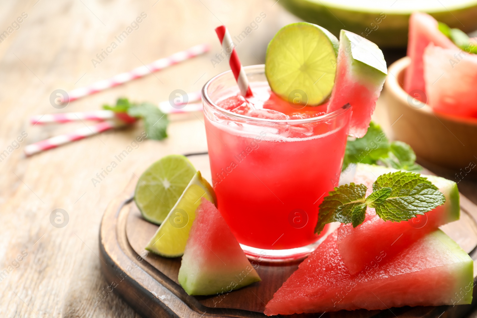 Photo of Delicious fresh watermelon drink on wooden table, closeup