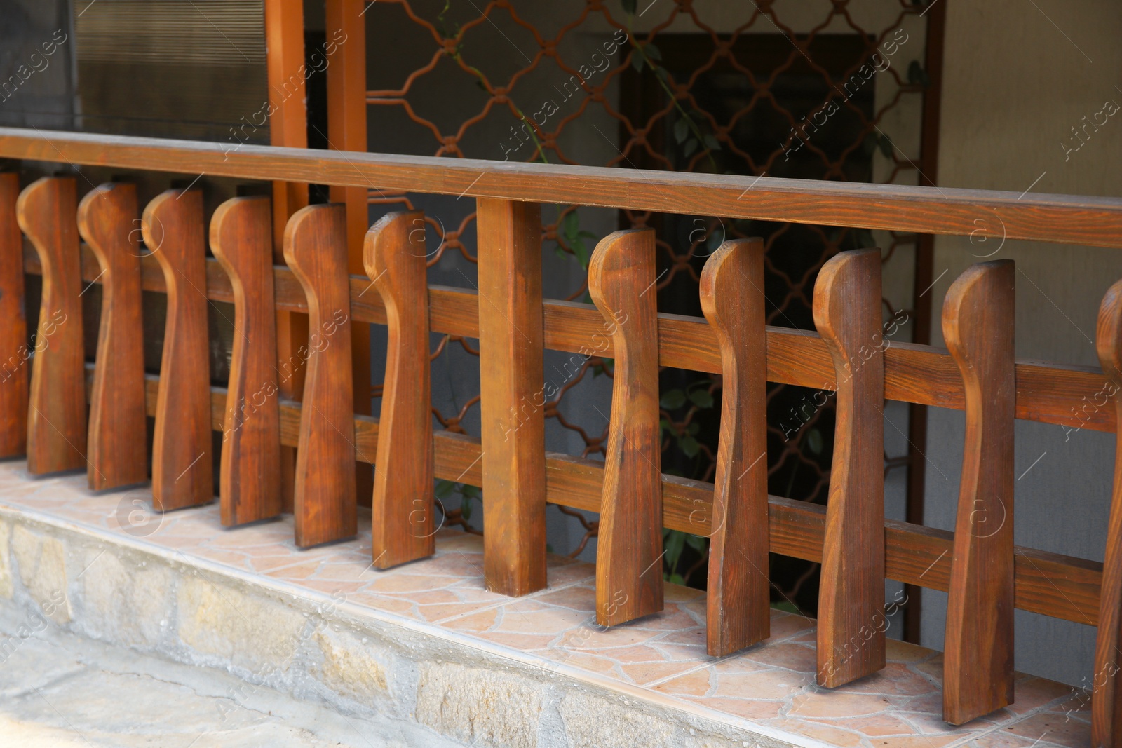 Photo of Beautiful low wooden fence near house outdoors