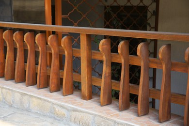 Photo of Beautiful low wooden fence near house outdoors