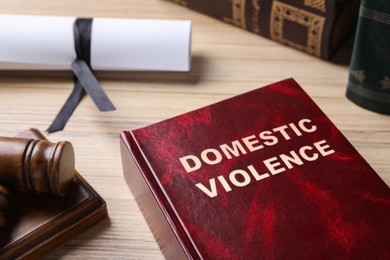 Photo of Domestic violence law book on wooden table