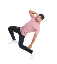 Young man in stylish jeans on white background