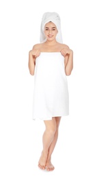 Full length portrait of young pretty woman with towels on white background