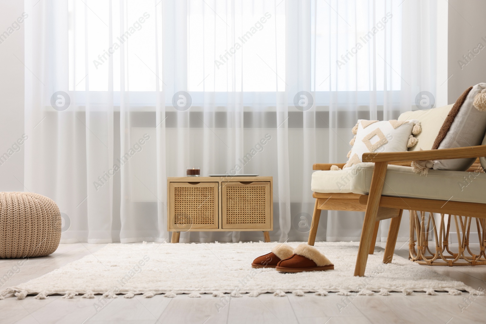 Photo of Stylish living room with soft white carpet and furniture. Interior design