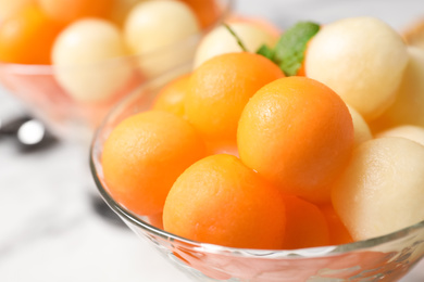 Photo of Melon balls and mint in glass, closeup