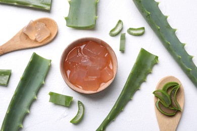 Photo of Flat lay composition with aloe vera gel and slices of plant on white background
