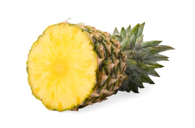 Tasty cut pineapple with leaves on white background