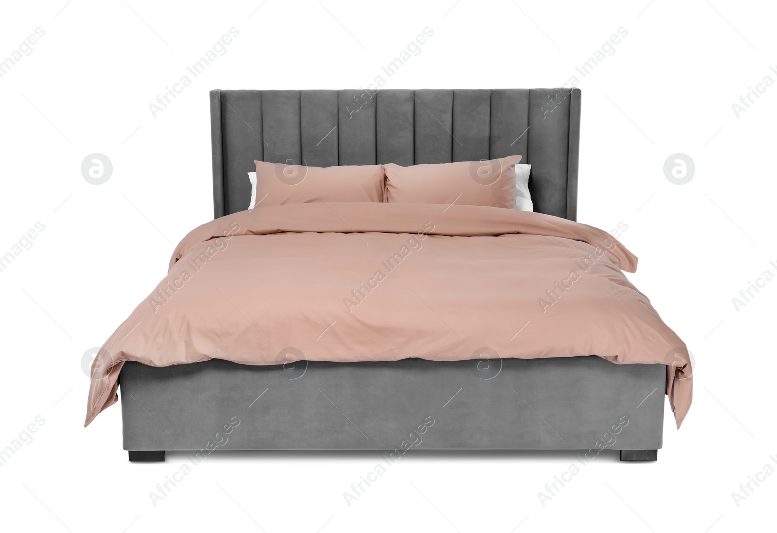 Photo of Comfortable gray bed with beige linens on white background