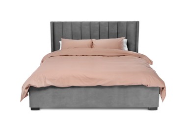 Photo of Comfortable gray bed with beige linens on white background