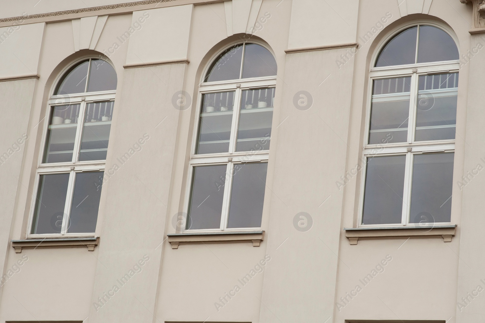 Photo of View on building with three arched windows