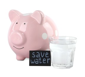 Photo of Water scarcity concept. Card with phrase Save Water, piggy bank and glass of drink isolated on white
