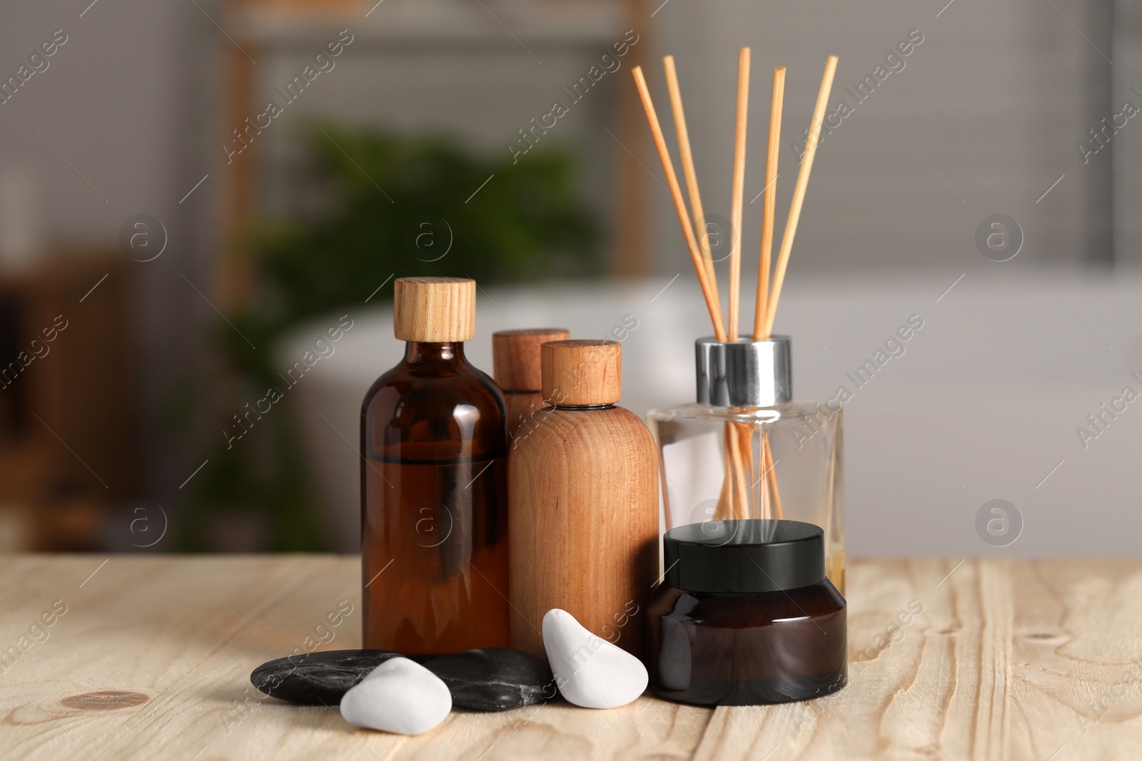 Photo of Composition with spa products on wooden table in bathroom, closeup