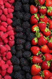 Photo of Mix of different ripe tasty berries as background, top view