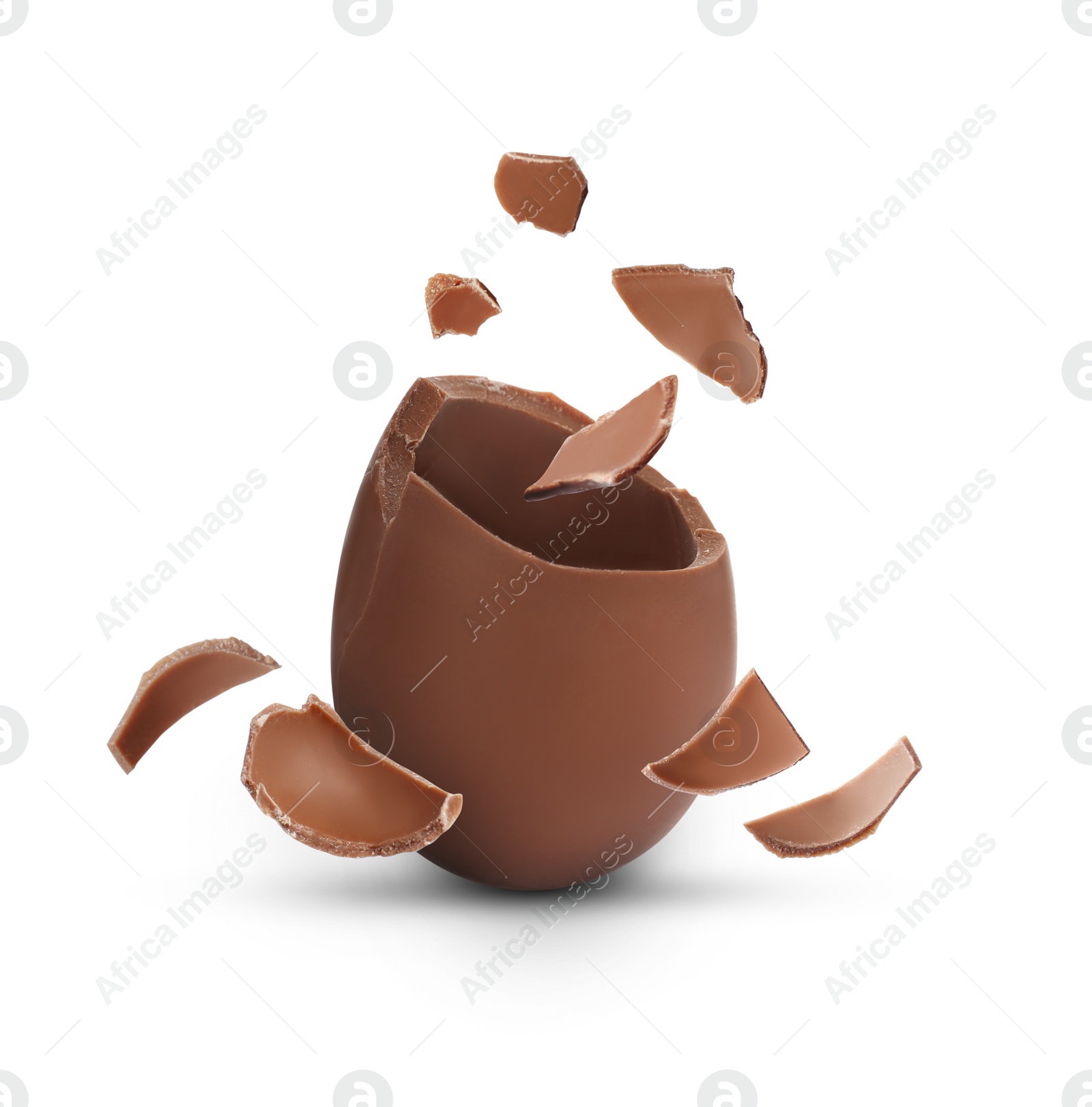 Image of Exploded milk chocolate egg on white background