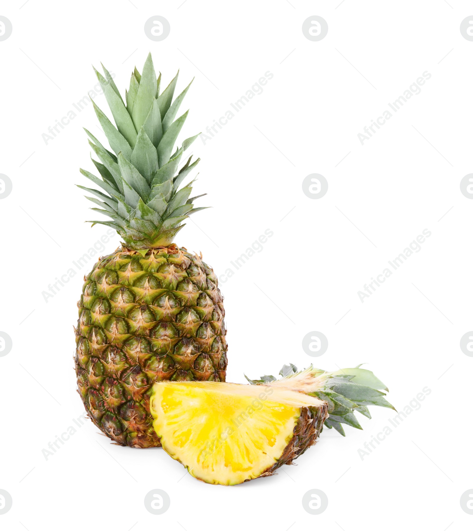 Photo of Whole and cut ripe pineapples isolated on white