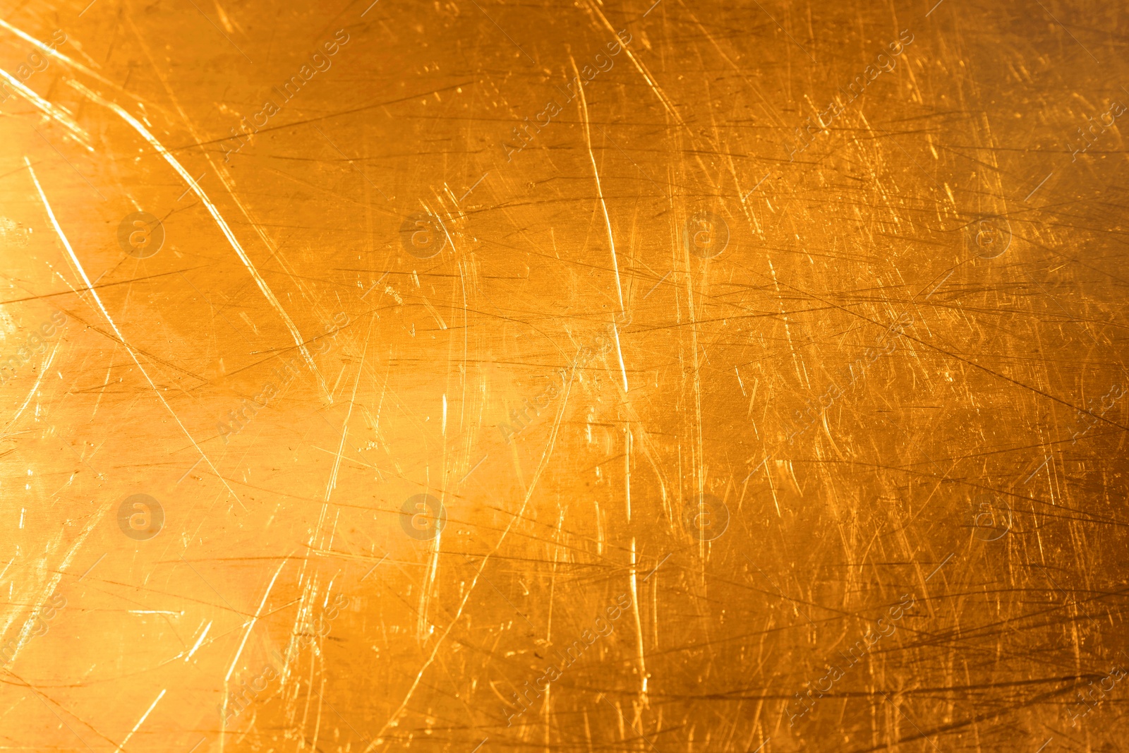 Image of Golden textured surface as background, closeup view