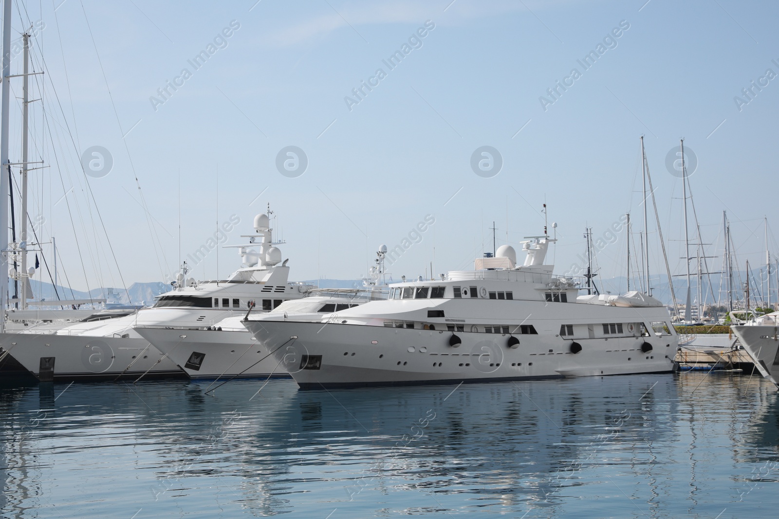 Photo of Beautiful view of different boats at pier on sunny day