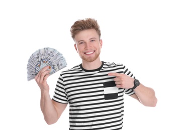 Happy young man with money on white background