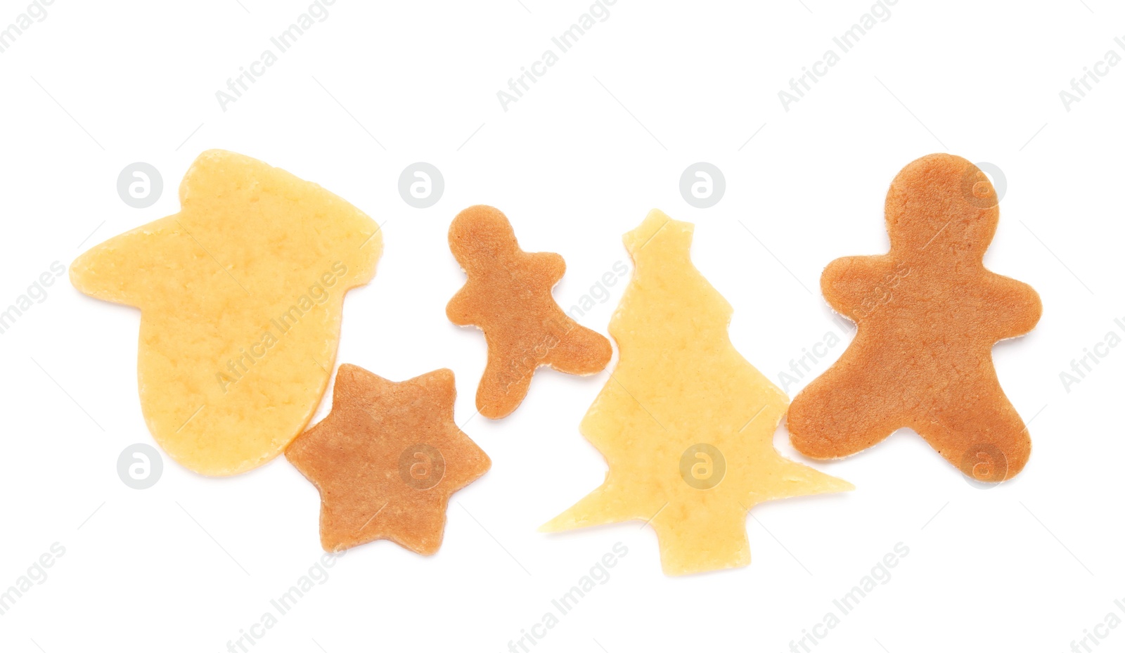 Photo of Unbaked Christmas cookies on white background, top view