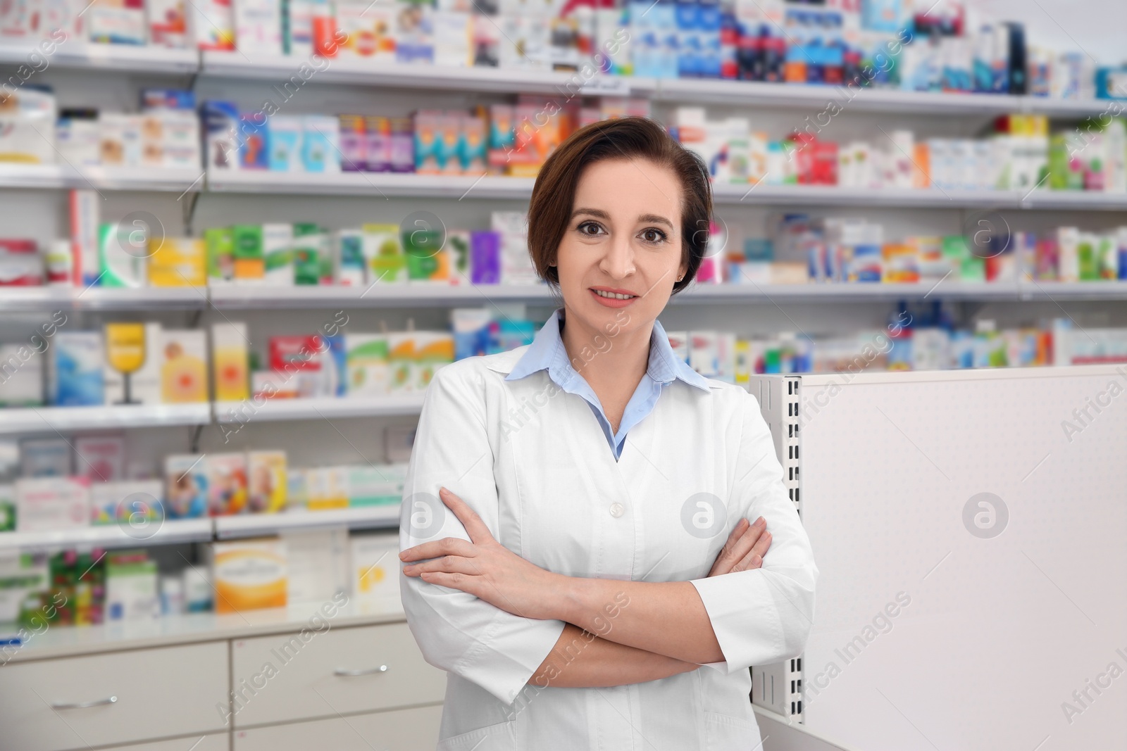 Photo of Portrait of professional pharmacist in modern drugstore