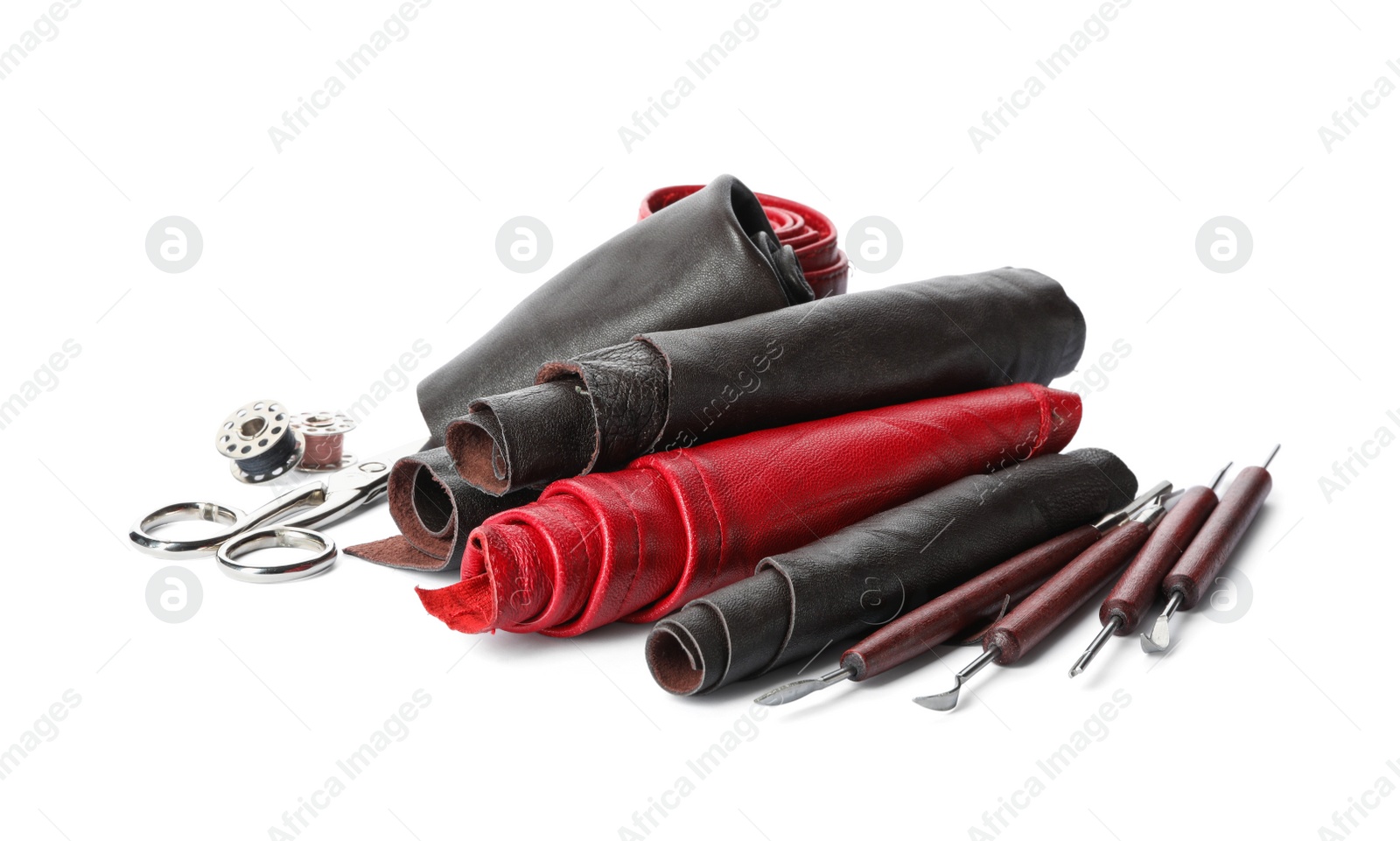 Photo of Leather samples and craftsman tools isolated on white