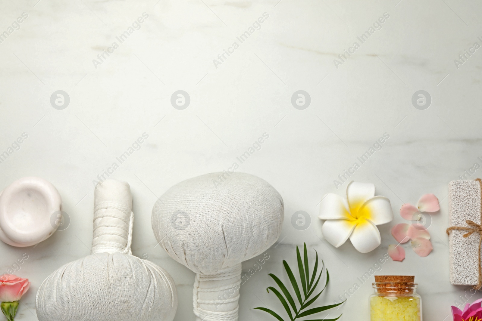 Photo of Flat lay composition with different spa products on white marble table. Space for text