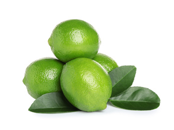 Photo of Fresh ripe limes with green leaves isolated on white