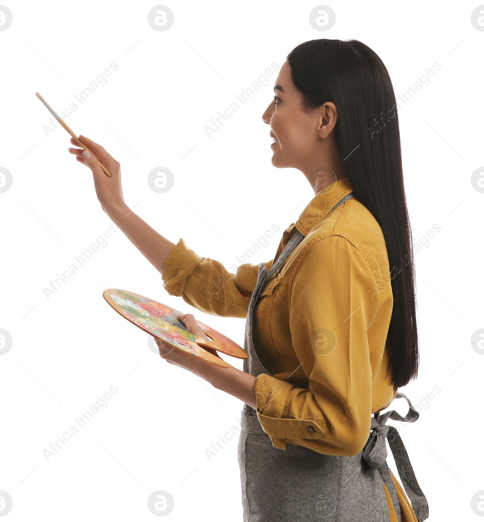 Photo of Young woman drawing with brush on white background