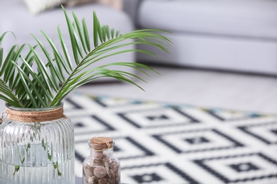 Vase with tropical leaves indoors. Interior design element