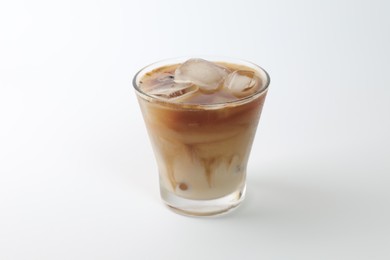 Iced coffee with milk in glass on white background