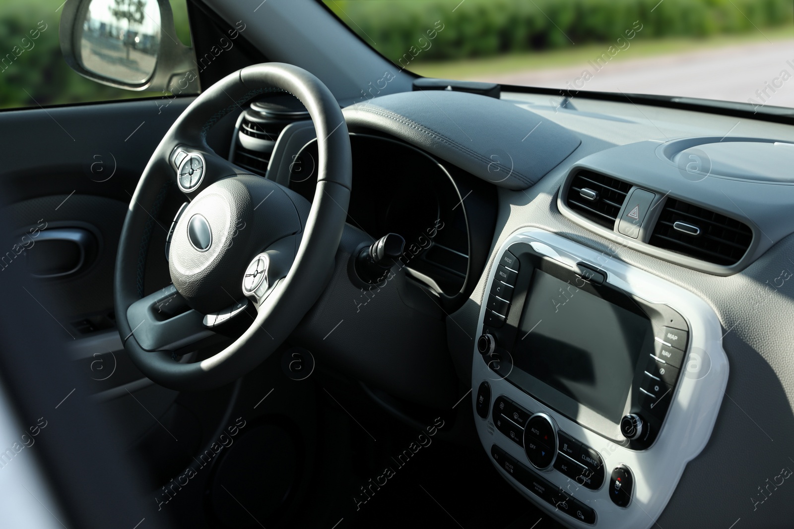 Image of Steering wheel and dashboard in modern car