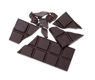 Photo of Pieces of delicious dark chocolate bar on white background, top view