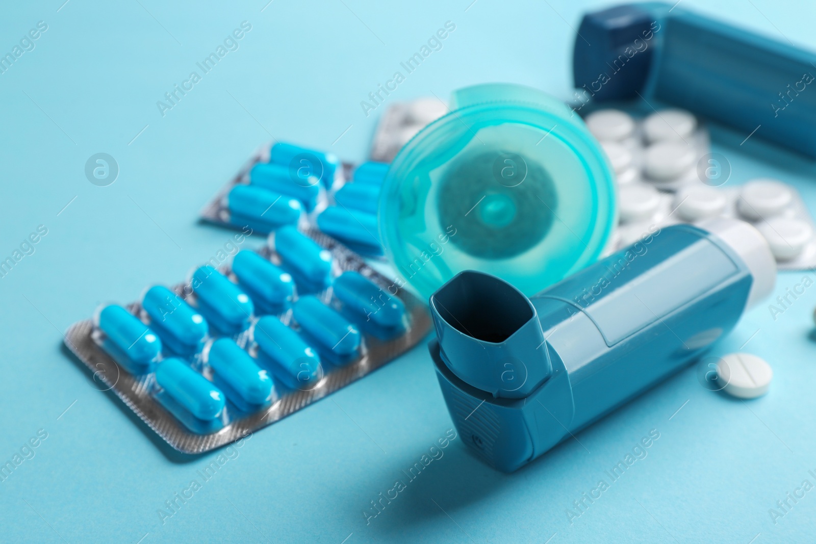 Photo of Set of asthma medications on color background