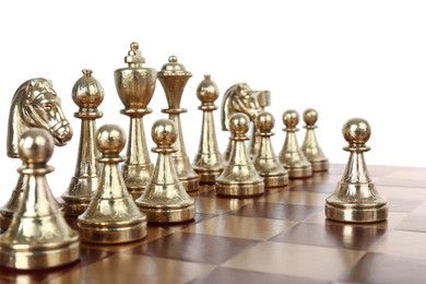 Pawn in front of other chess pieces on wooden board against white background