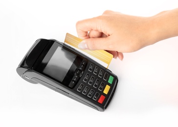 Woman using modern payment terminal on white background, closeup