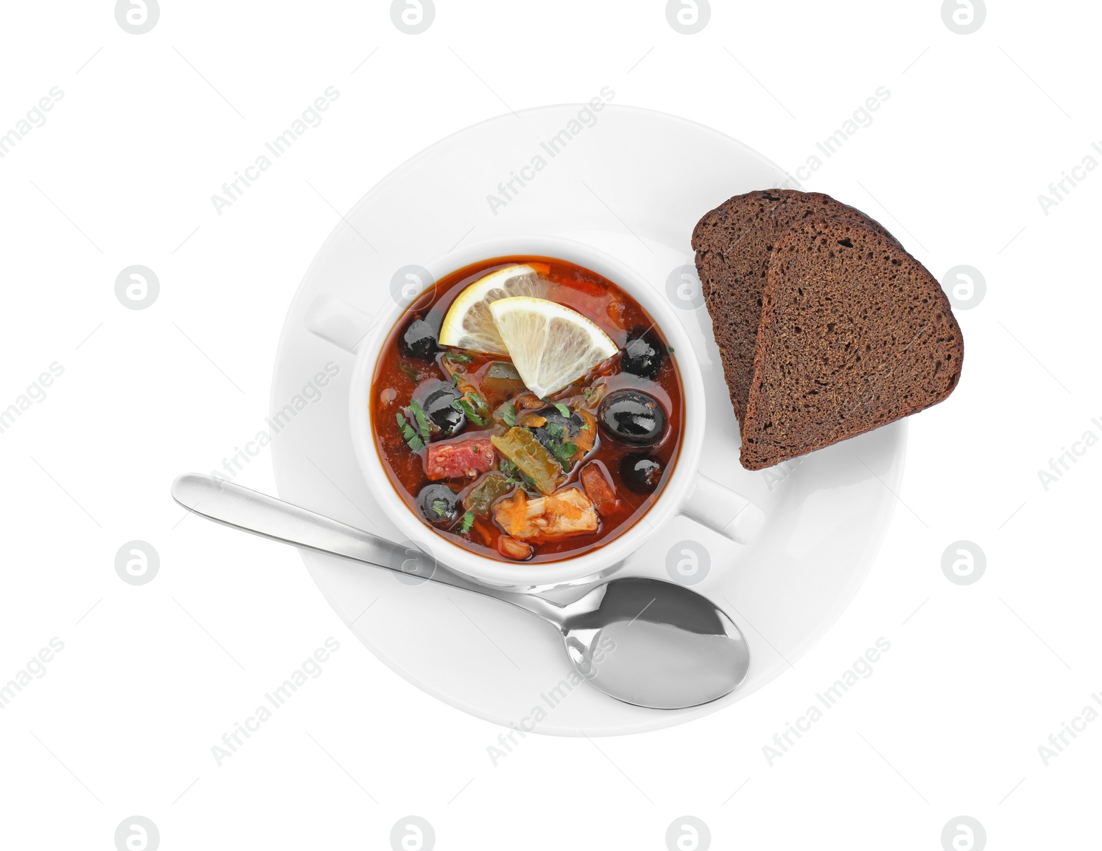 Photo of Meat solyanka soup served with bread isolated on white, top view