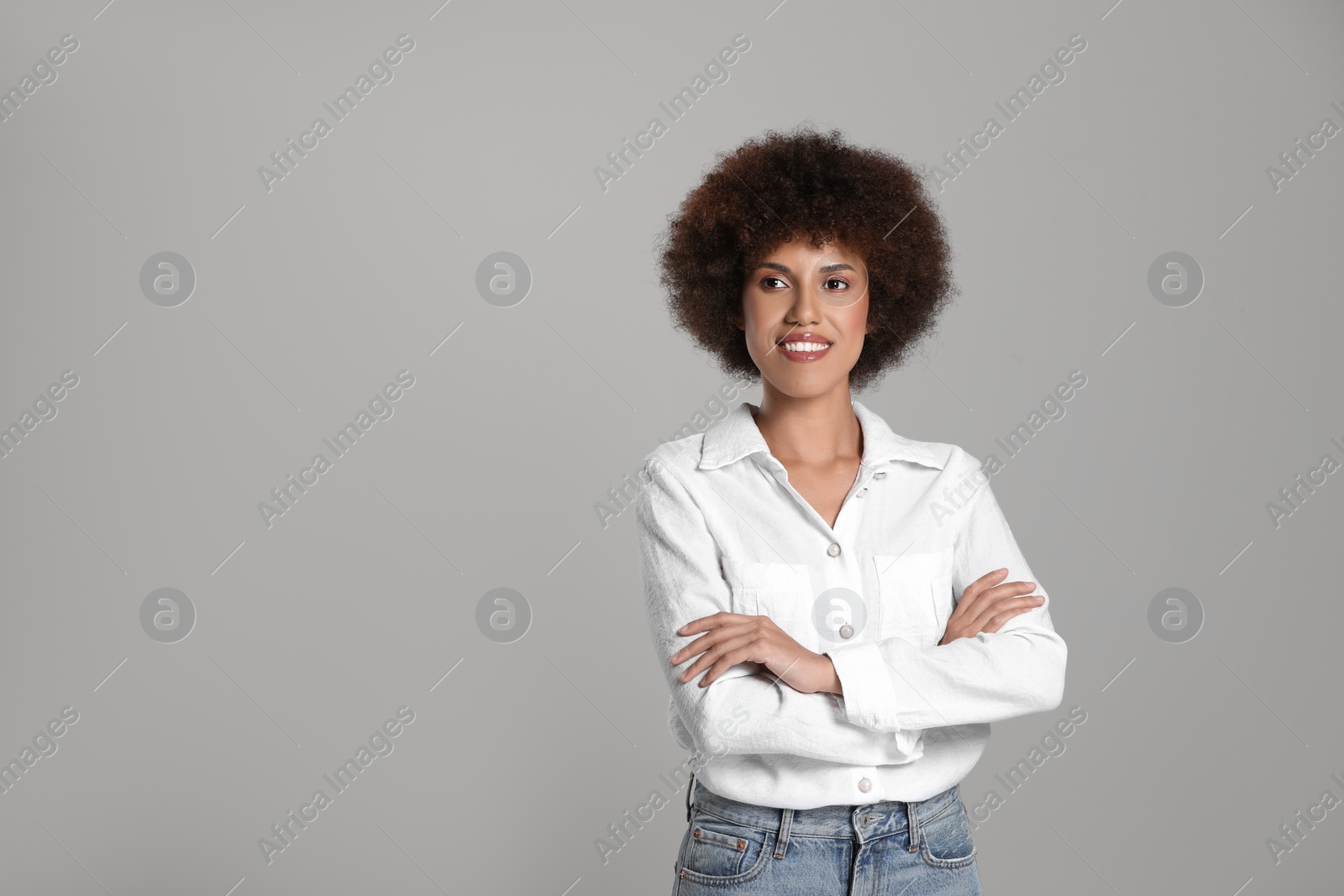 Photo of Portrait of beautiful young woman on grey background. Space for text