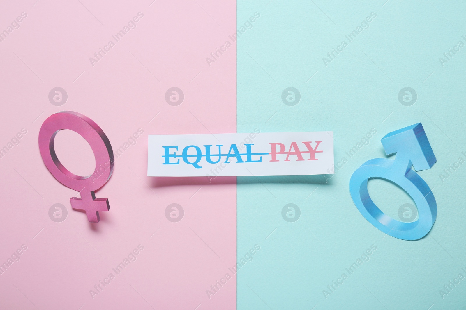 Photo of Equal pay concept. Gender symbols on color background, flat lay
