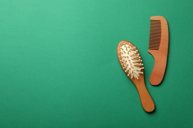 Wooden brush and comb on green background, flat lay with space for text. Conscious consumption