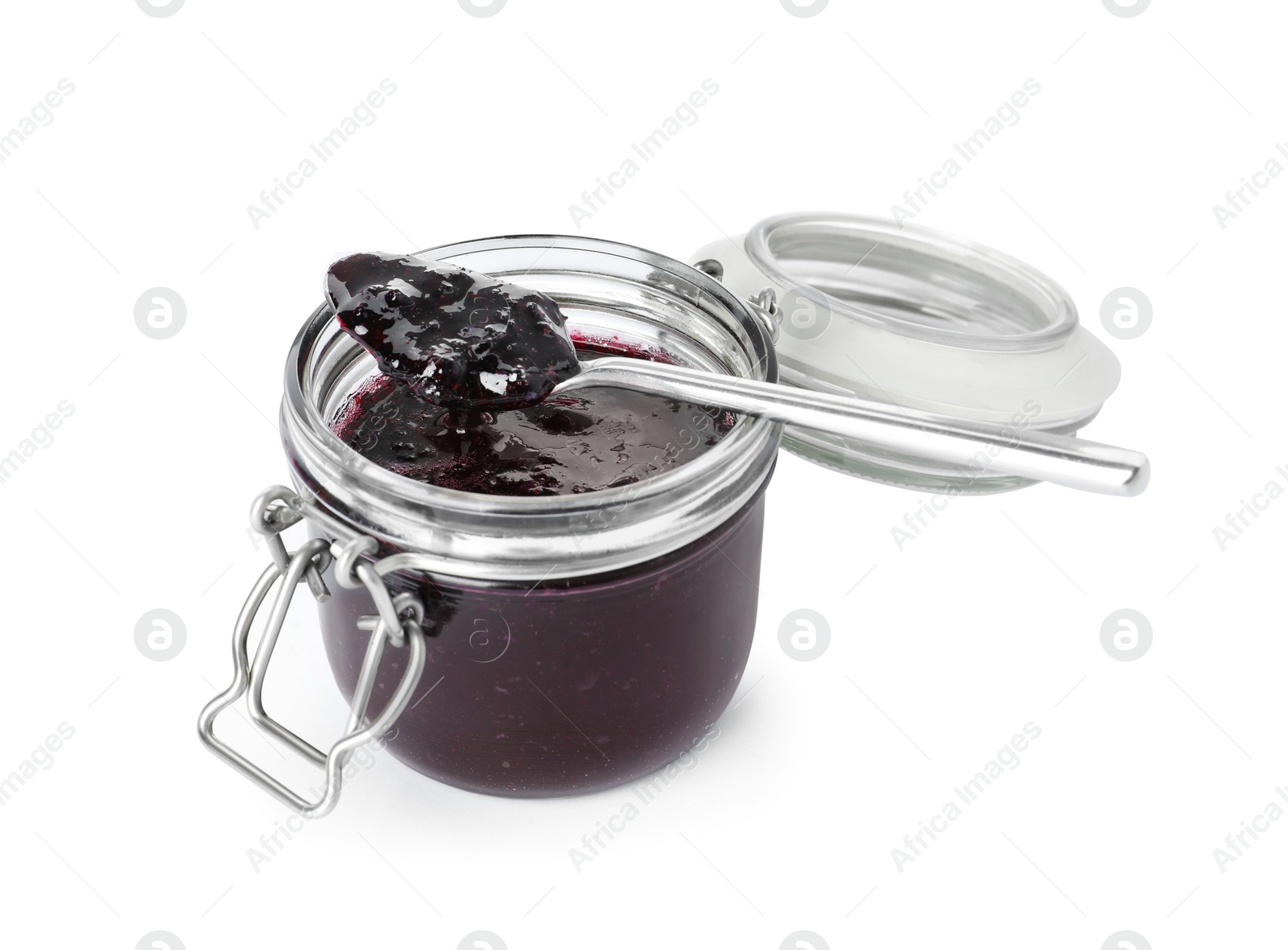 Photo of Spoon and jar of blueberry jam isolated on white