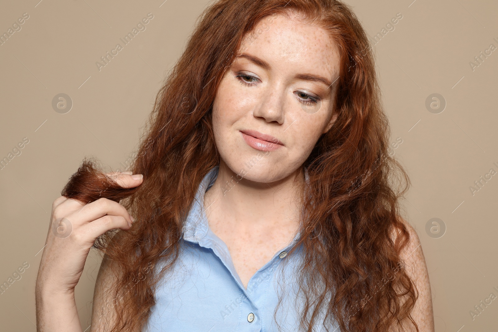 Photo of Portrait of young woman with beautiful face on beige background, closeup