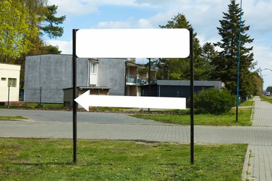 Image of Empty signboard with arrow outdoors. Mock-up for design