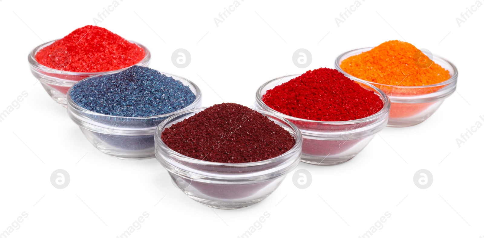 Photo of Glass bowls with different food coloring isolated on white