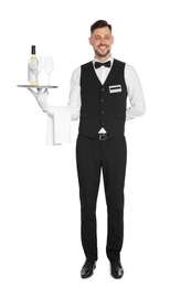 Photo of Handsome waiter holding tray with glass and bottle of wine on white background
