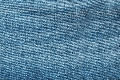 Texture of blue jeans as background